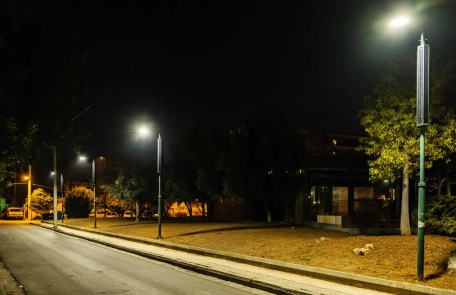 Cylindrical Solar Panel Street Lighting at Dusk Illuminated LED street light with a pole-mounted cylindrical solar panel at dusk