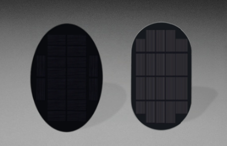 Two dark oval solar panels with elongated outlines and visible cell grid lines