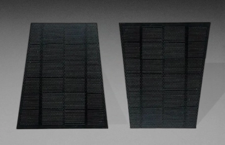 Two trapezoidal solar panels with tapered sides displayed in opposite orientations