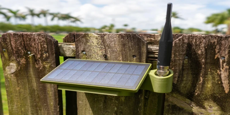 Small solar panel mounted above an outdoor wireless sensor enclosure